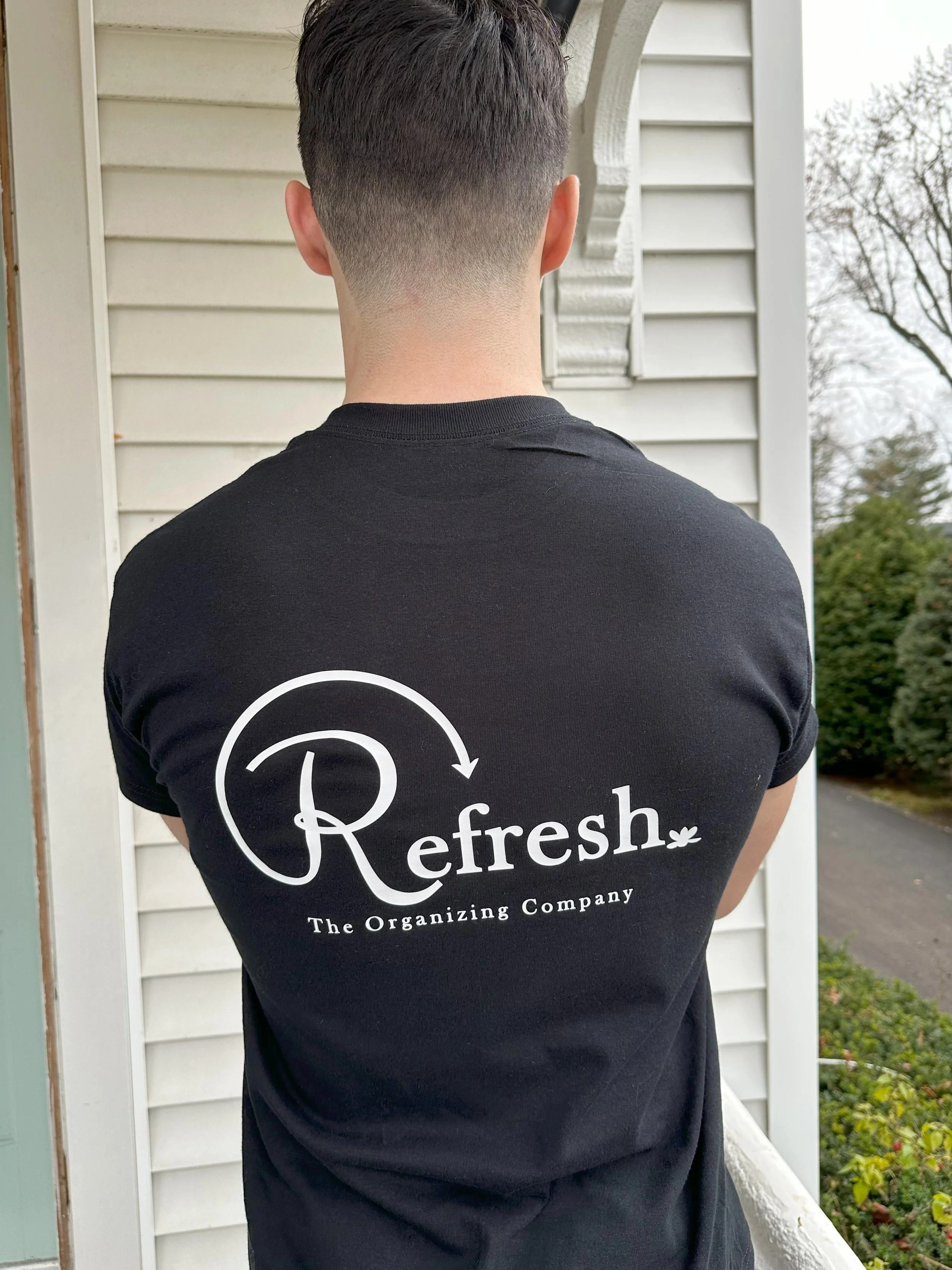 Refresh crew member posing for a photo to show our logo design.