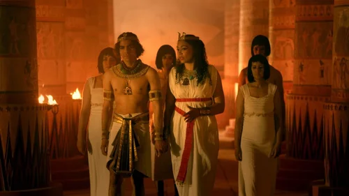 Costumed cast in a torch-lit palace scene from Queens of Ancient Egypt