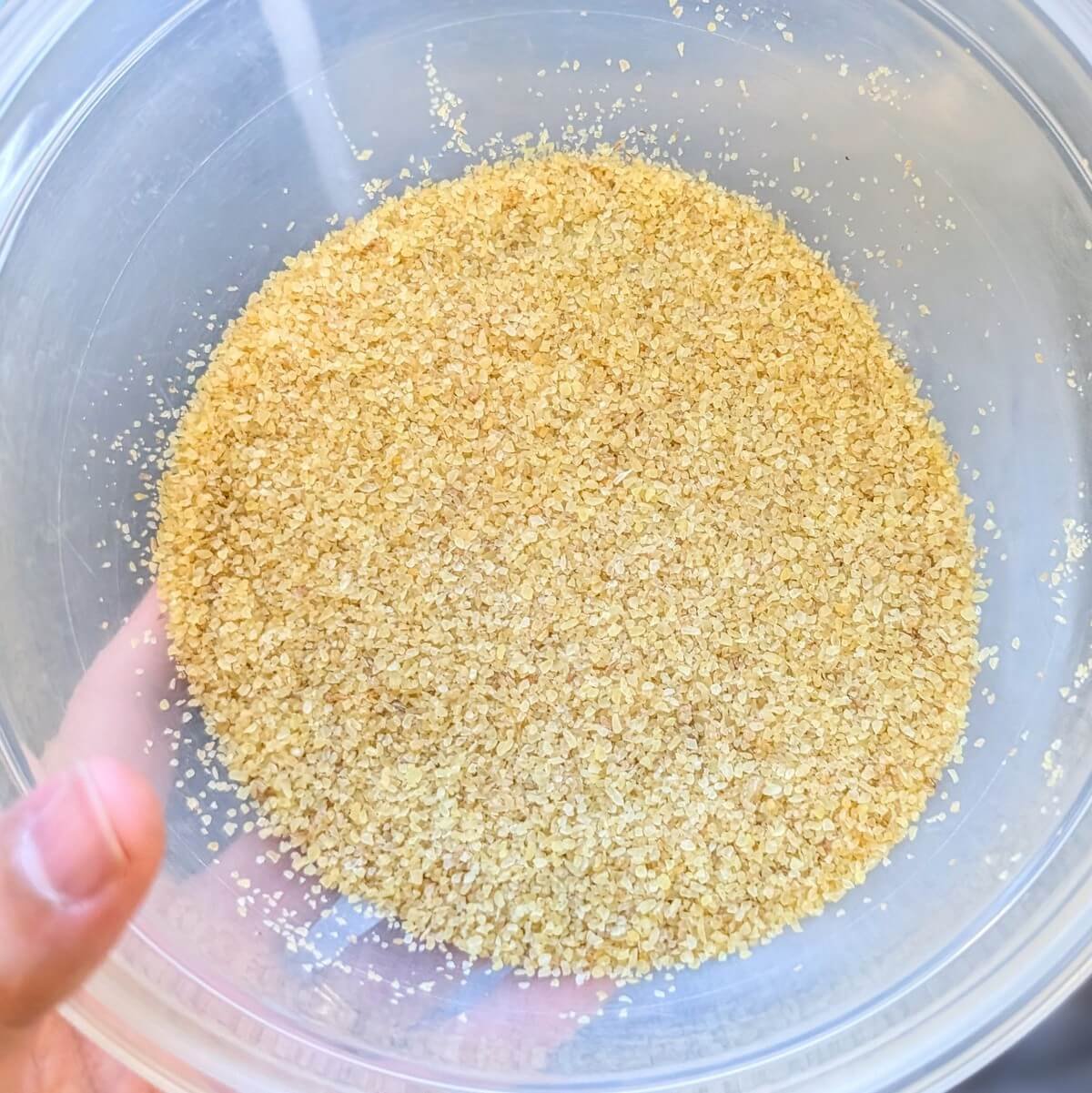 A bowl with fine bulgur wheat, ready for soaking to make traditional tabouli salad