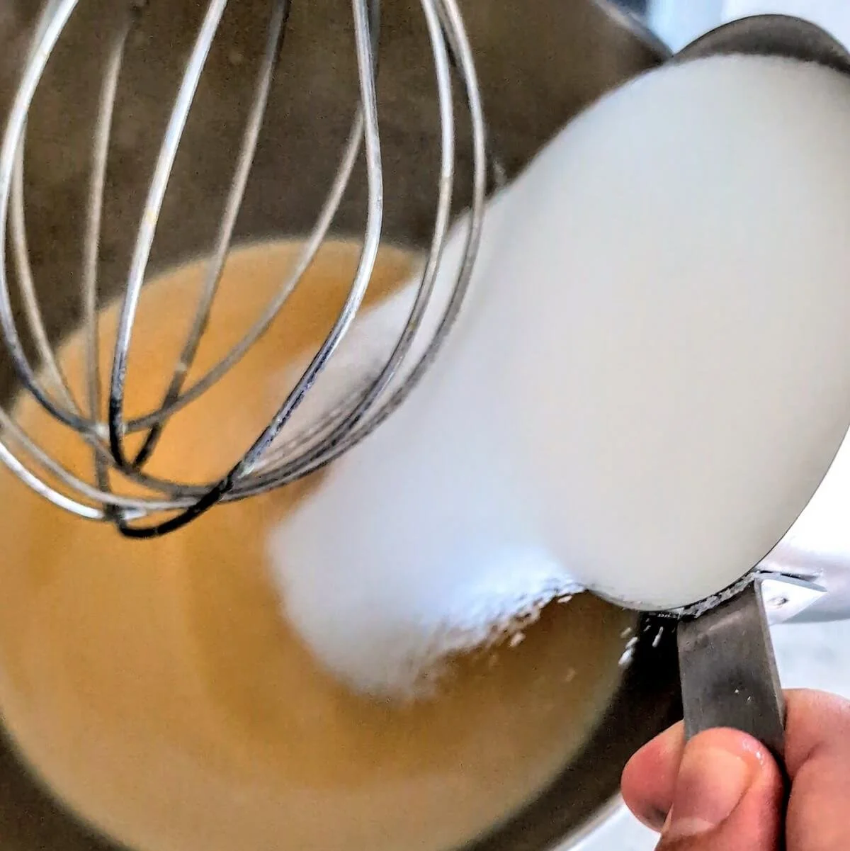 Adding sugar to the egg and alcohol mixture for aged egg nog