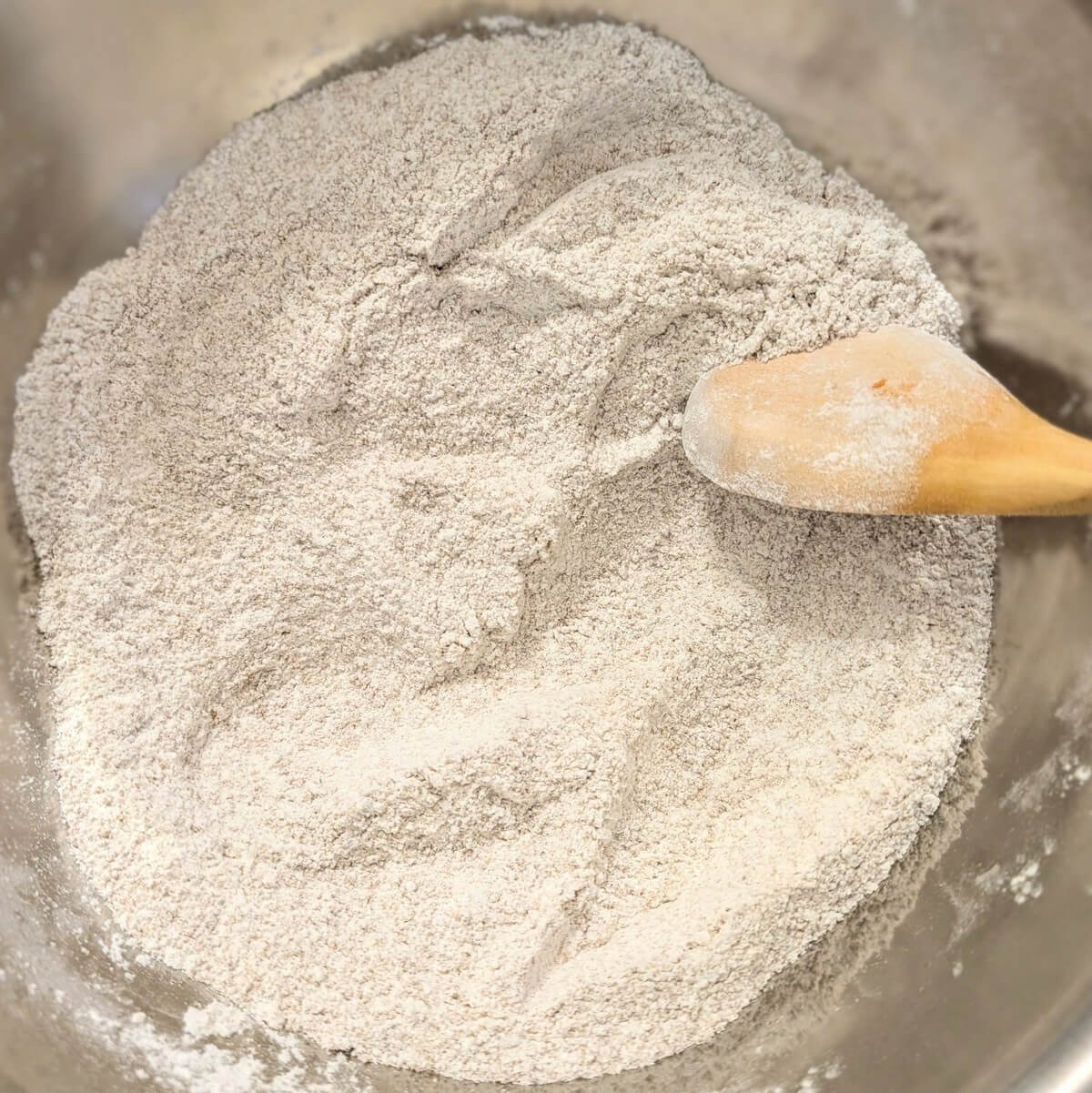 Evenly combined dry ingredients for chocolate chunk sea salt cookies in a mixing bowl