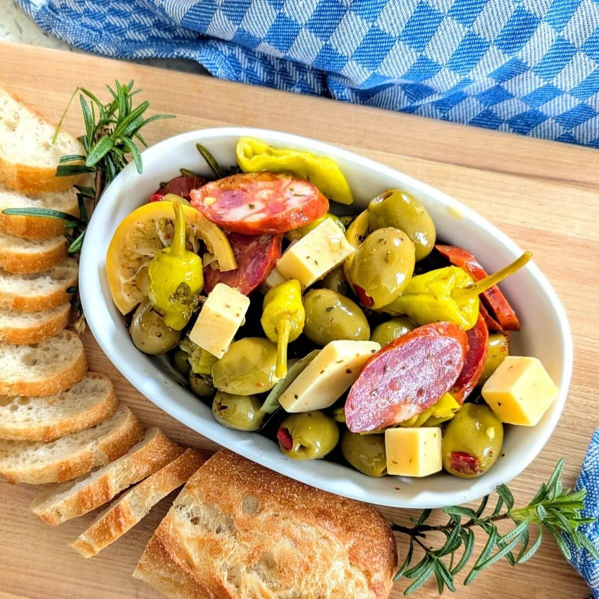 What&rsquo;s your favorite holiday party appetizer? 🎄

Mine might have to be this marinated antipasto.

Made with cubes of cheese, stuffed olives, spicy chorizo, and pickled pepperoncini, all tossed in a herb-infused oil. The combo of spicy, briny, 