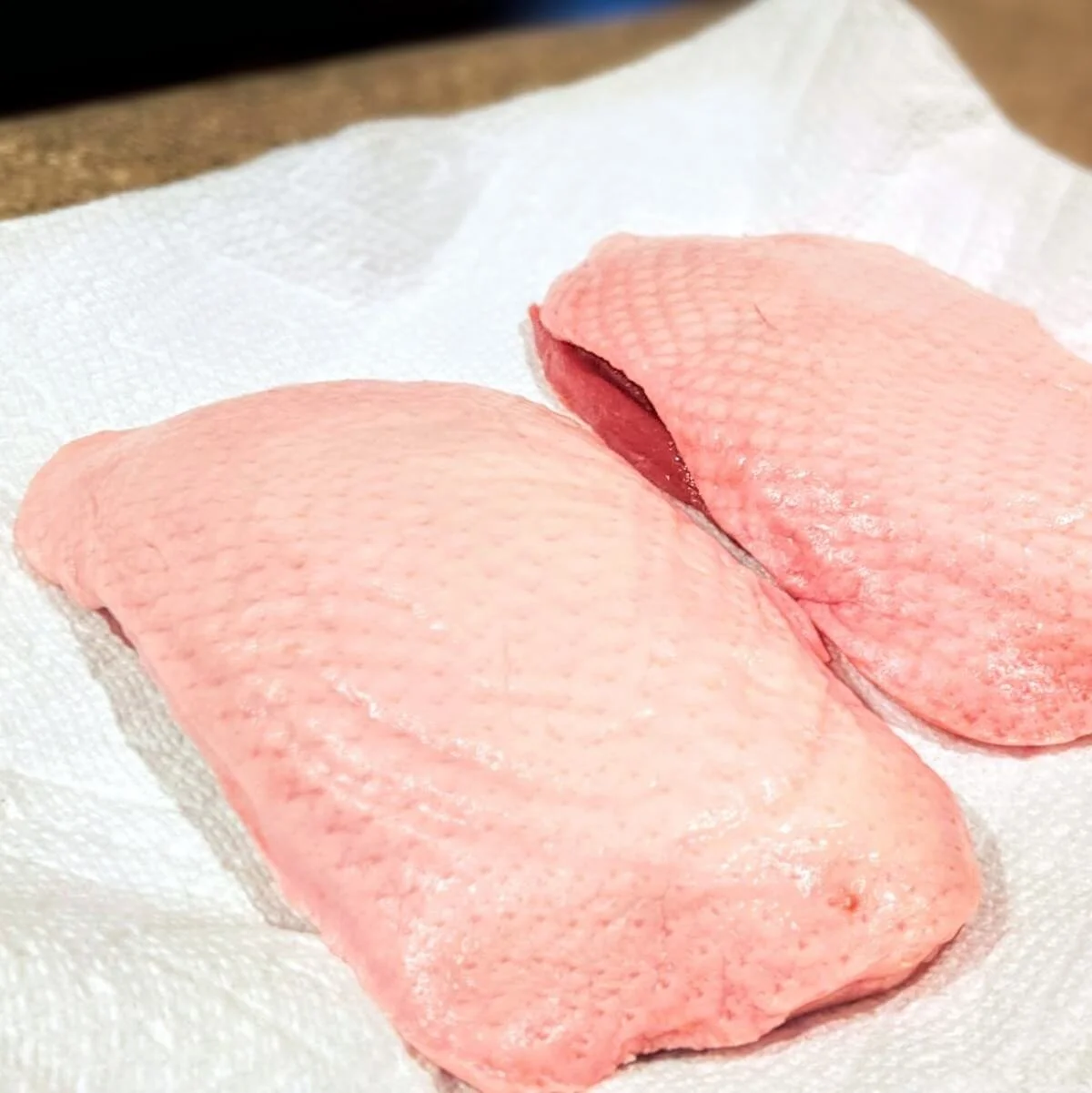 Duck breasts patted dry on a paper towel before cooking pan seared duck breast