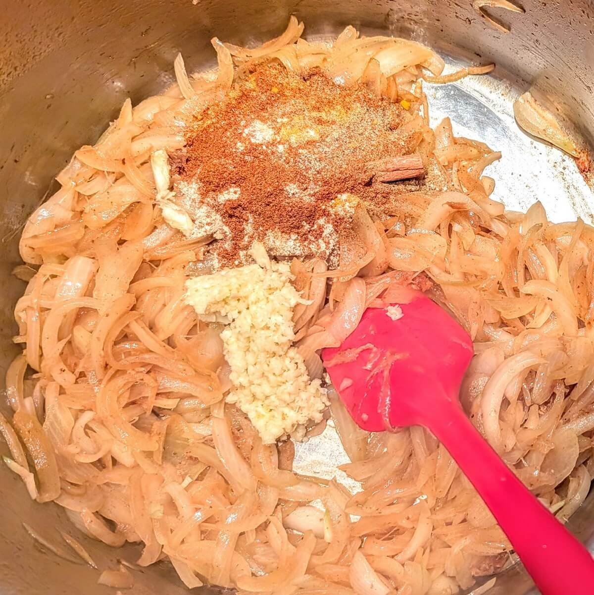 Garlic and homemade Moroccan spice blend added to onions for a rich base in chicken lemon olive tagine