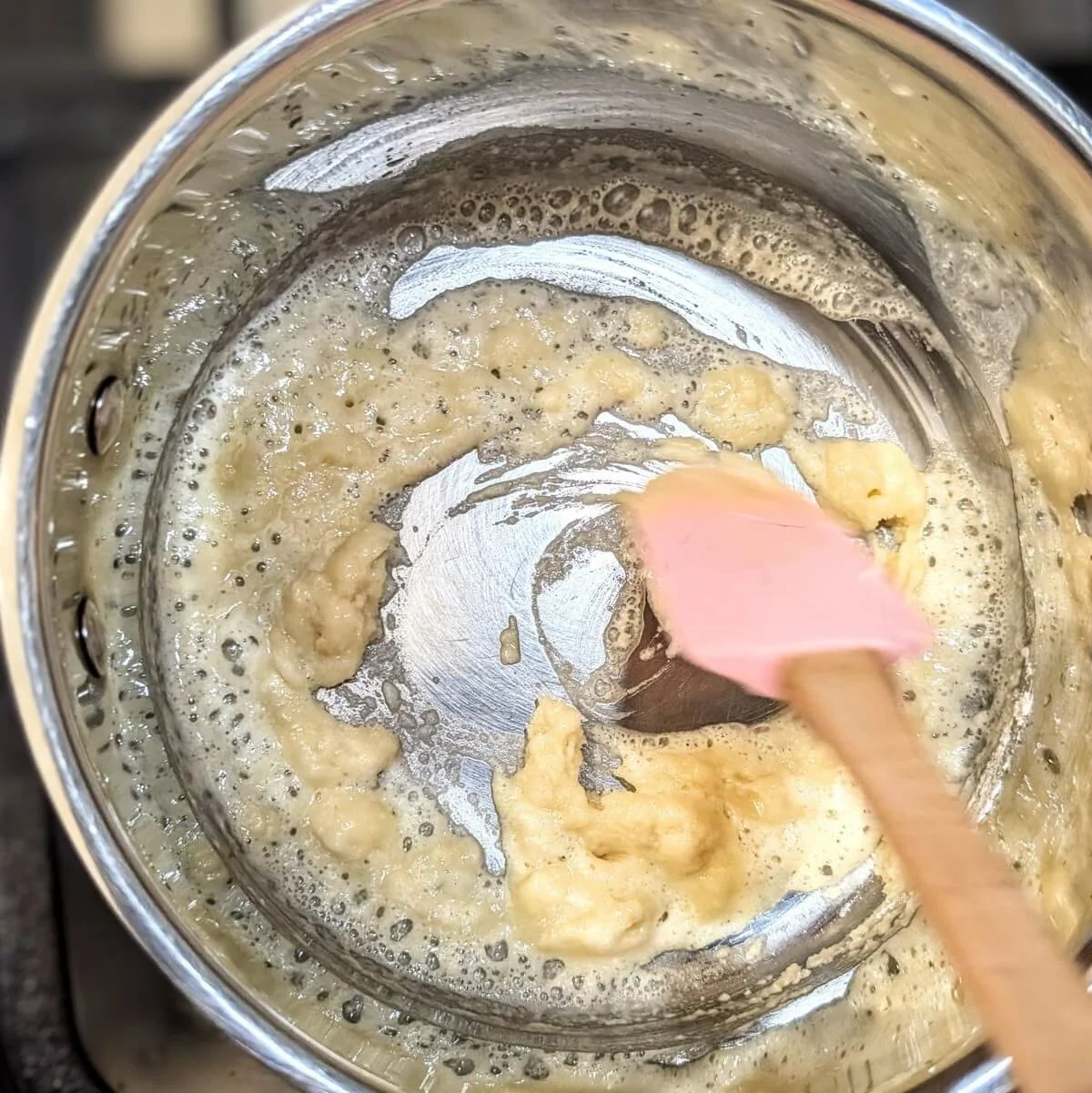Lightly toasted blond roux being stirred, used for velouté mother sauce
