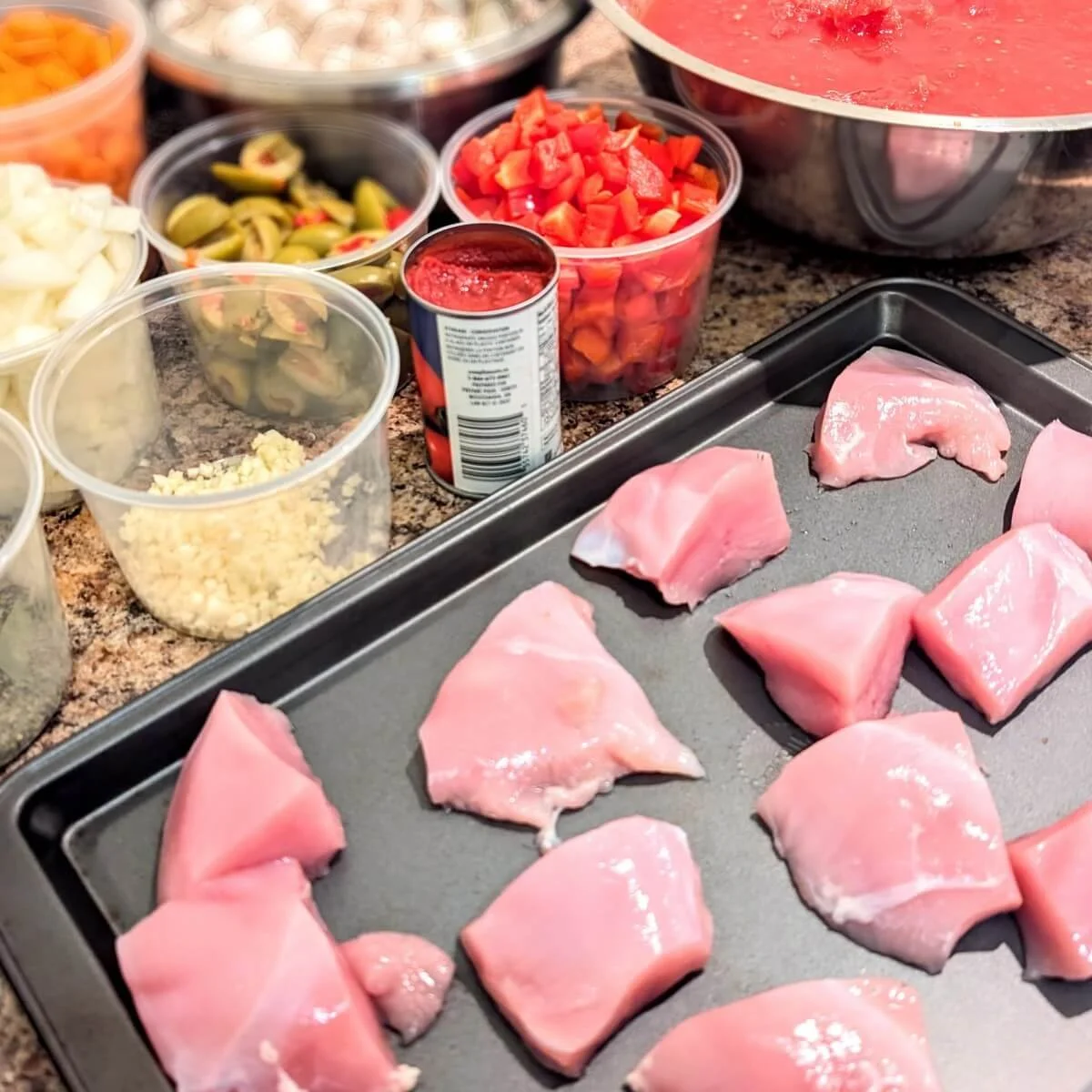 Ingredients for rustic turkey cacciatore arranged on a counter before cooking