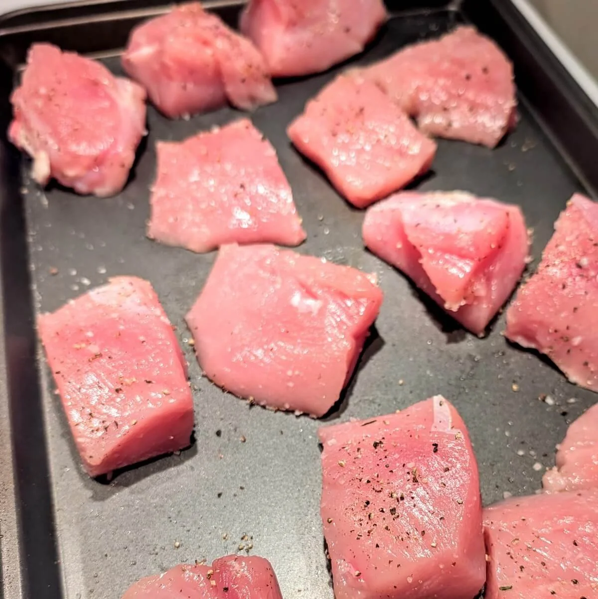 Raw turkey breast pieces seasoned and ready for stovetop cacciatore