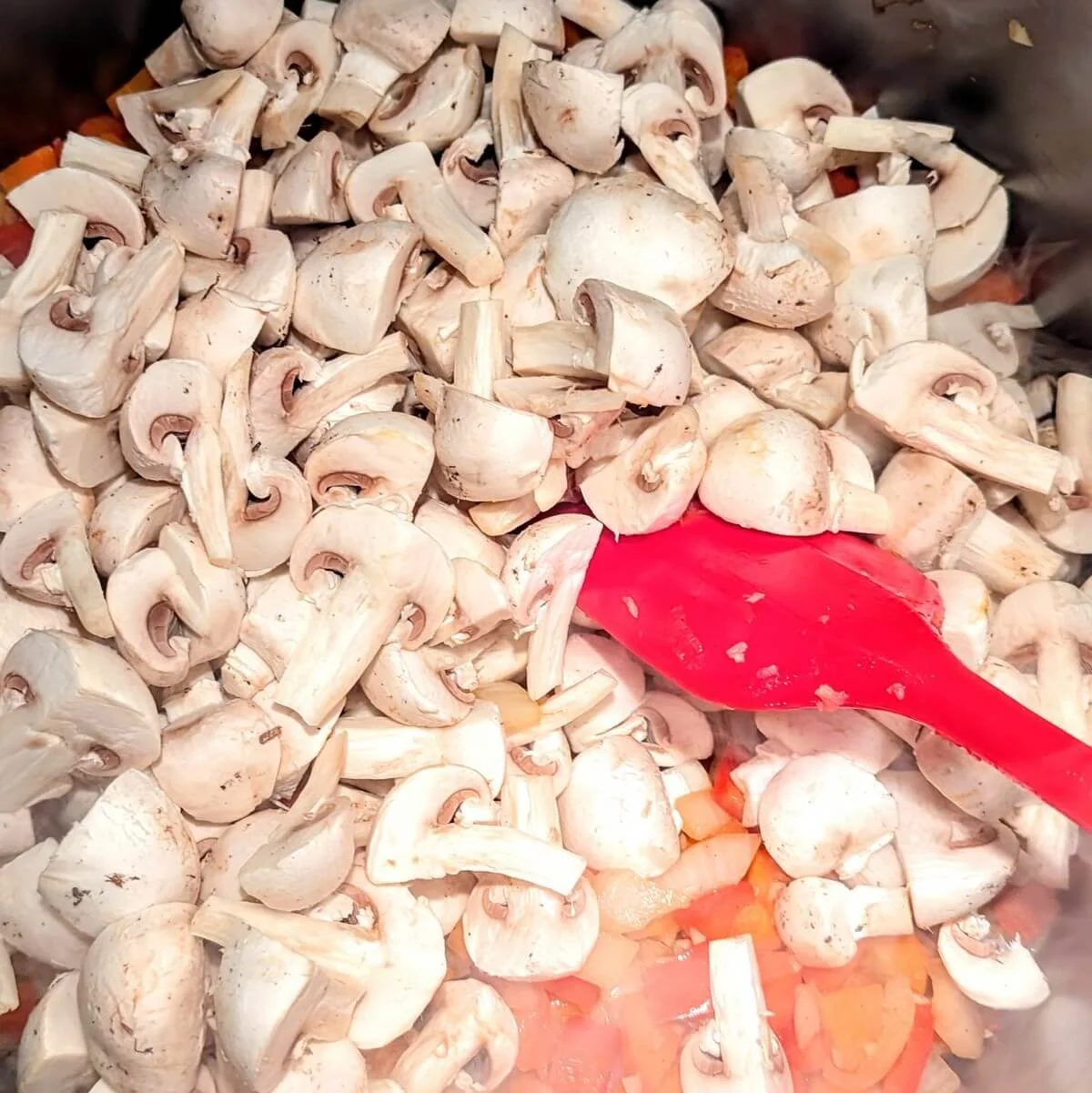 White mushrooms added to the soffritto base for homemade turkey cacciatore