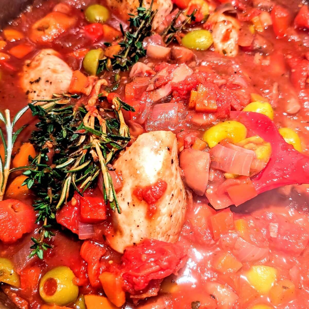 All turkey cacciatore ingredients stirred together before simmering on the stovetop