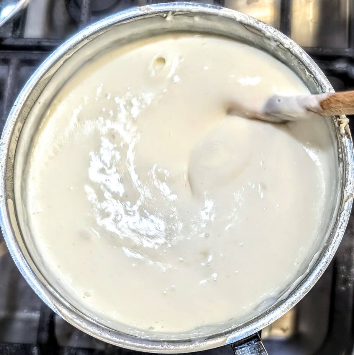 Homemade white sauce recipe ready to use in baked mac and cheese, pasta, or lasagna