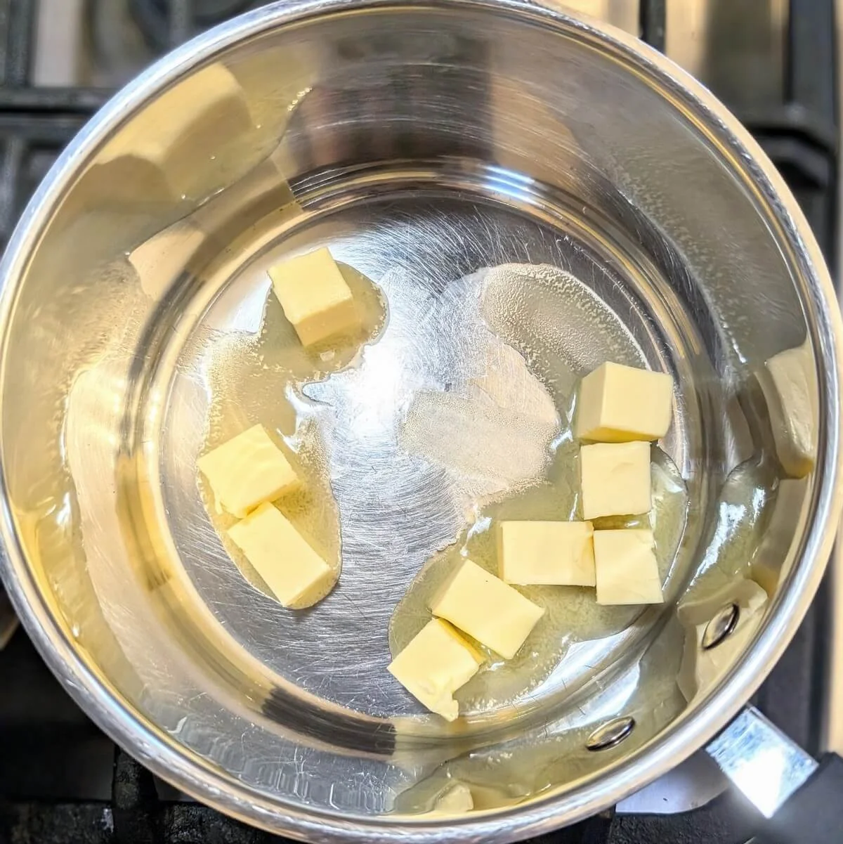 Butter melting in a saucepan to start a white roux for bechamel sauce