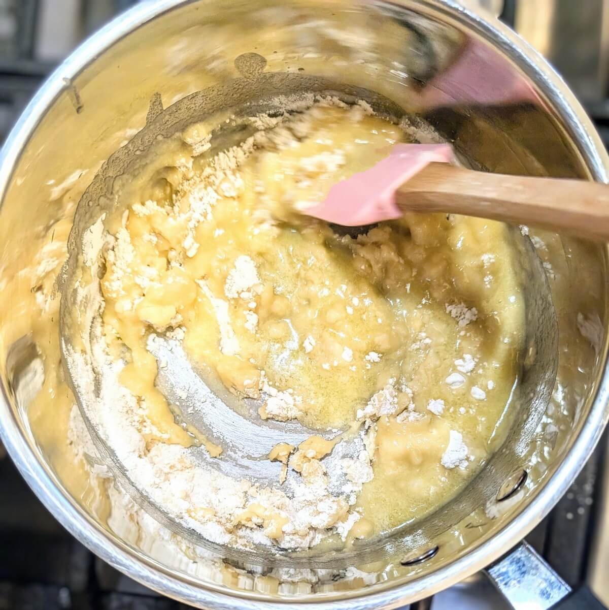 White roux being cooked for authentic bechamel sauce for lasagna