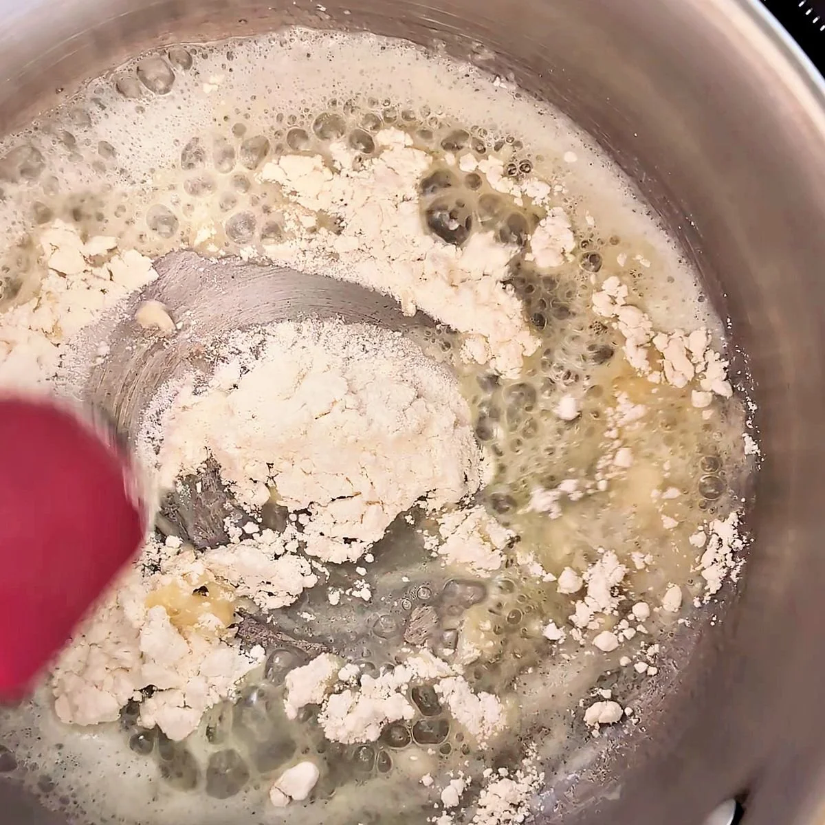 Flour added to melted butter to begin a roux for cheese sauce