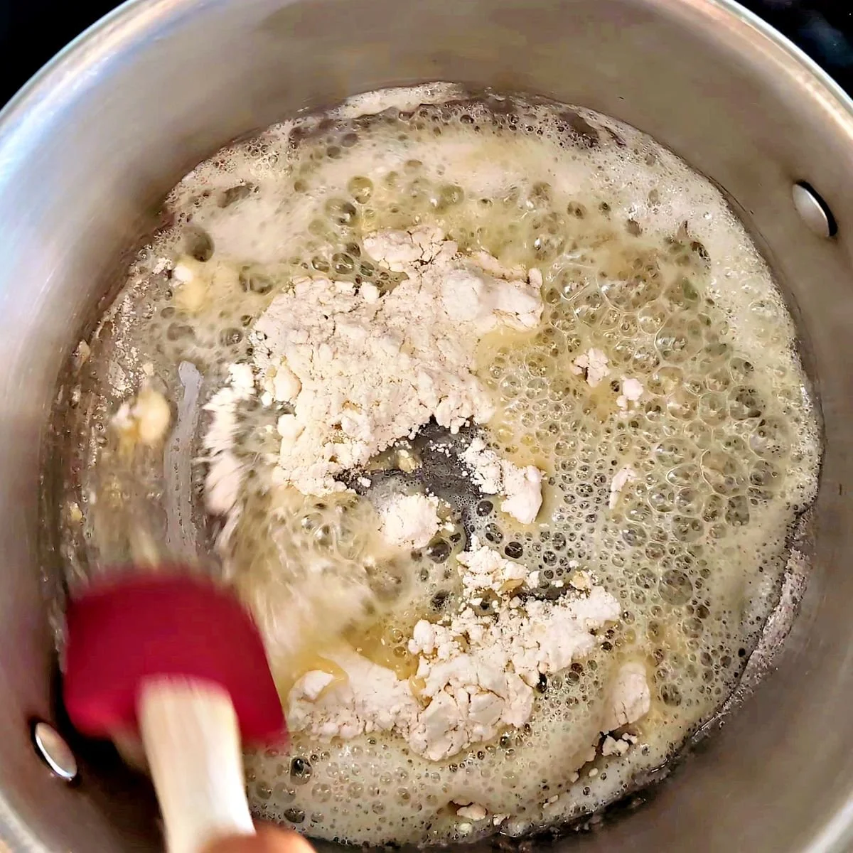 Flour added to melted butter to make a blond roux for velouté sauce