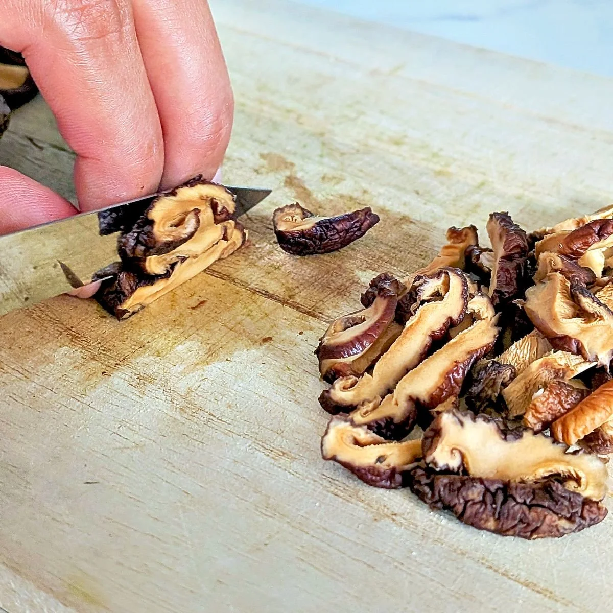 Slicing rehydrated shiitake mushrooms for mushroom gravy
