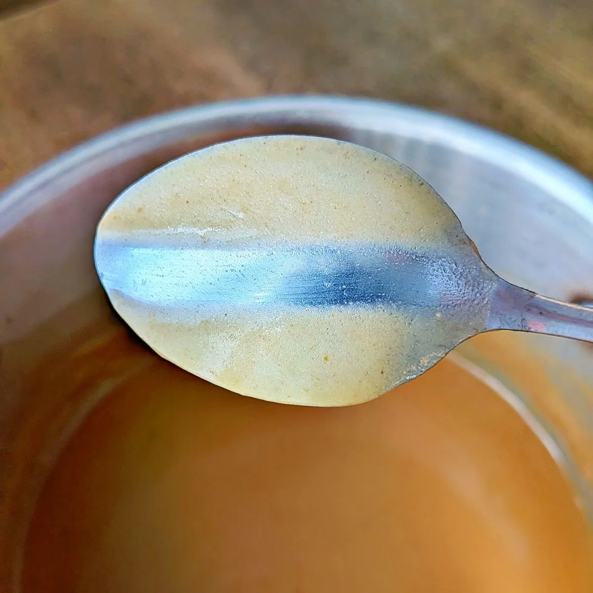 Line drawn through gravy on the back of a spoon to check for nappe consistency
