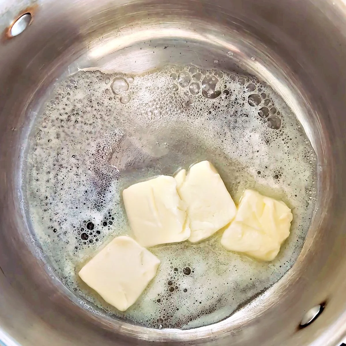 Melted butter in a small saucepan before adding flour to make roux