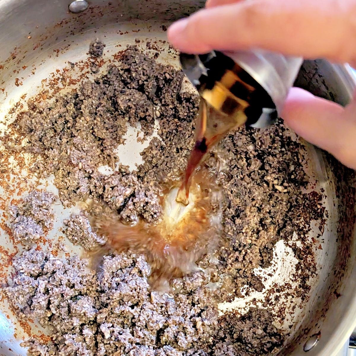 Deglazing the mushroom duxelles with sherry