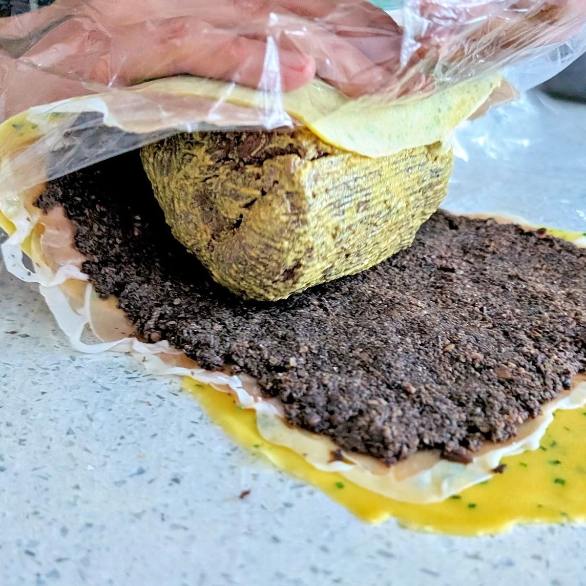 Crêpe and prosciutto layers rolled over the beef tenderloin