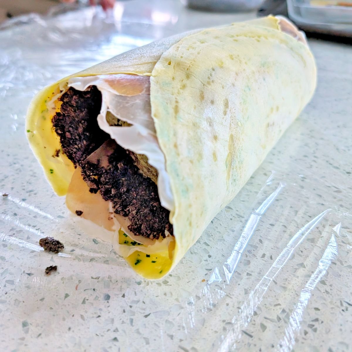 Beef tenderloin wrapped in the crêpe and mushroom layers