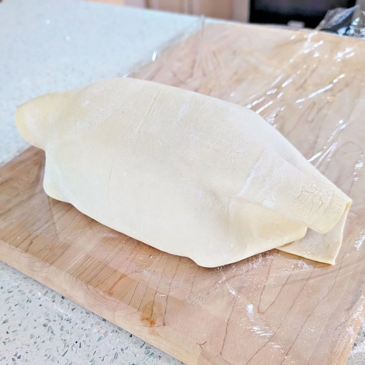 Wrapped beef Wellington with overlapping puff pastry seam