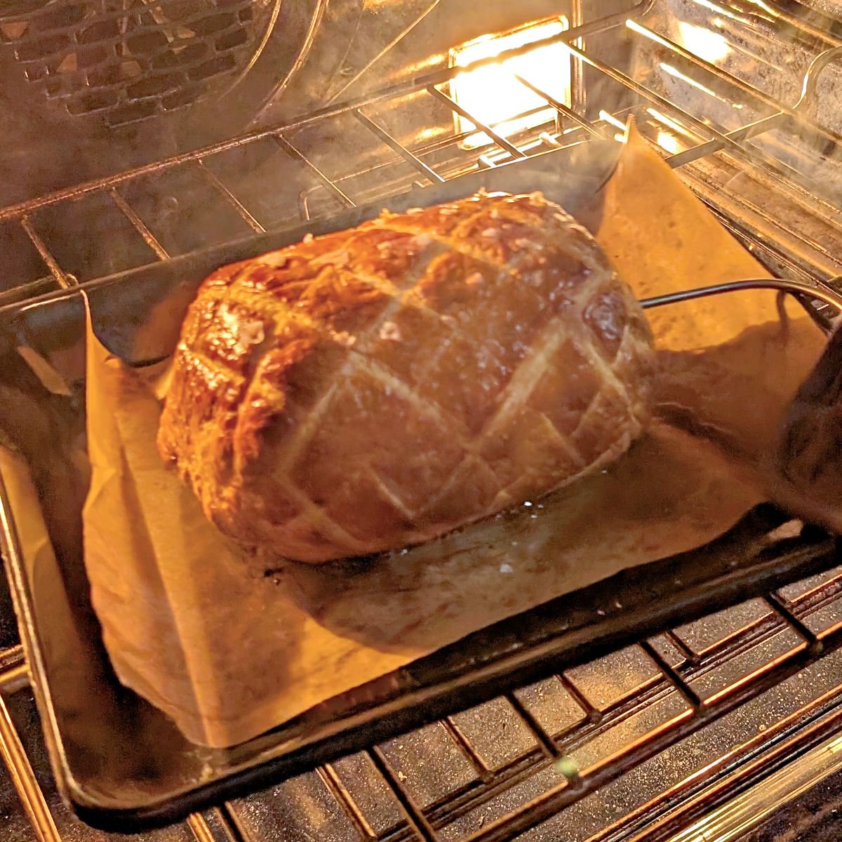 Golden brown beef Wellington baking in the oven