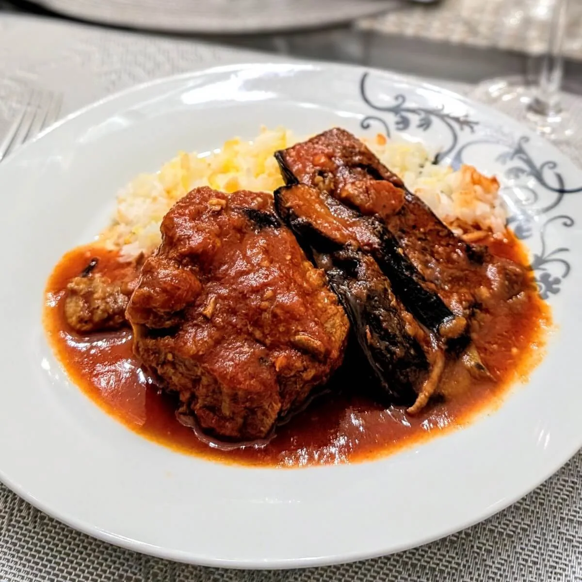 Iraqi lamb and eggplant stew served over white rice