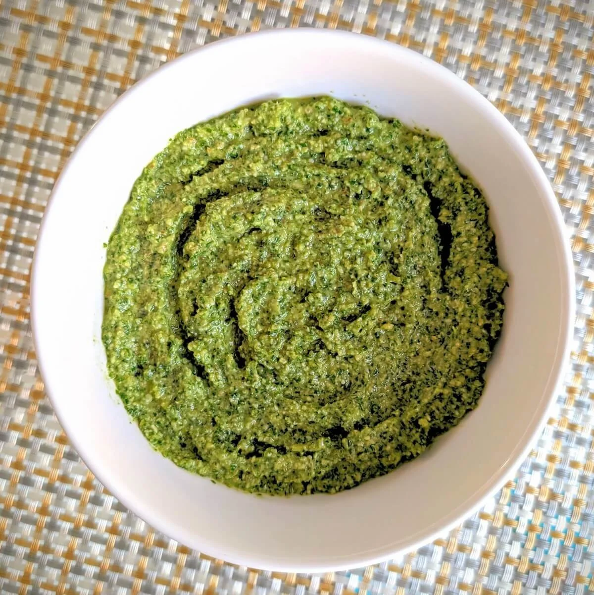 Bowl of arugula basil walnut pesto