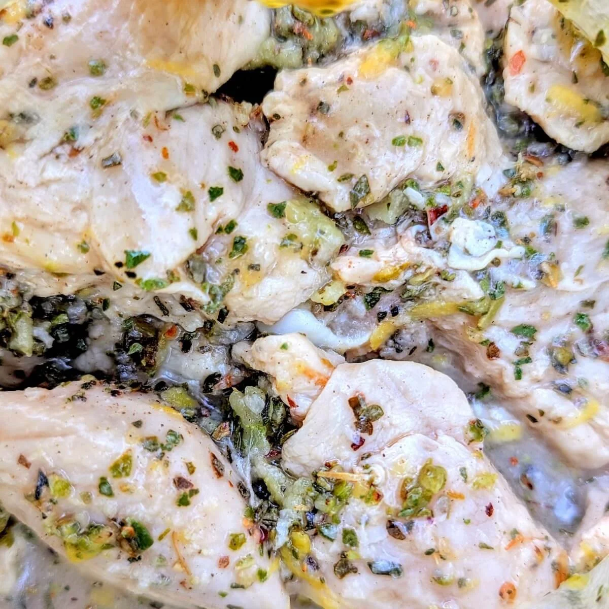 Chicken cubes coated in Greek souvlaki-style marinade for camping skewers