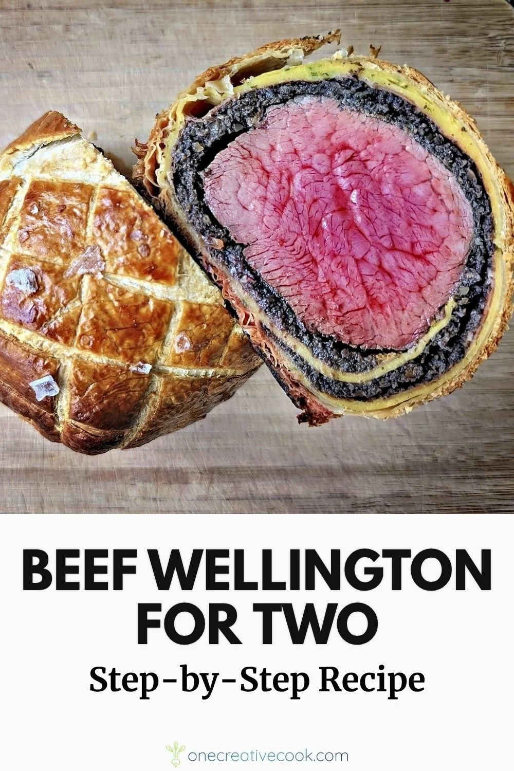 Homemade beef Wellington for 2 sliced open to show medium-rare beef, mushroom duxelles, and puff pastry