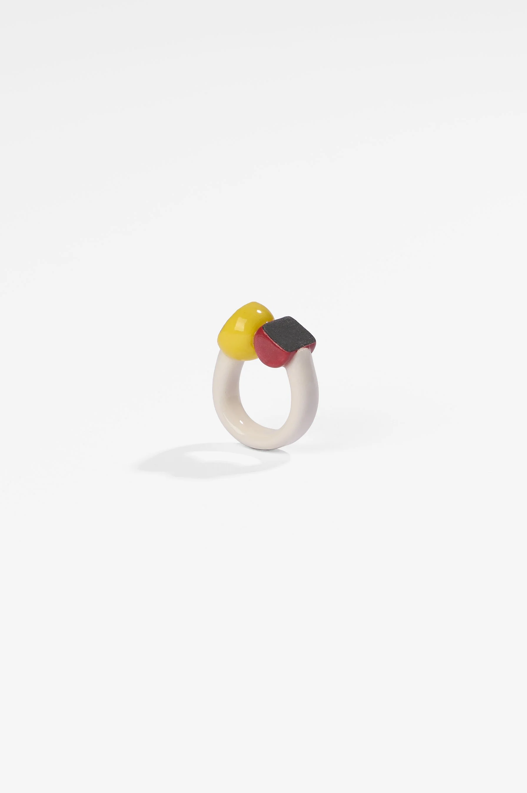 Manon van Kouswijk, Rings for Found Hands (red, yellow, black and white), porcelain, dimensions vary per ring, 2026, $590 each. Photography: Ross Coulter