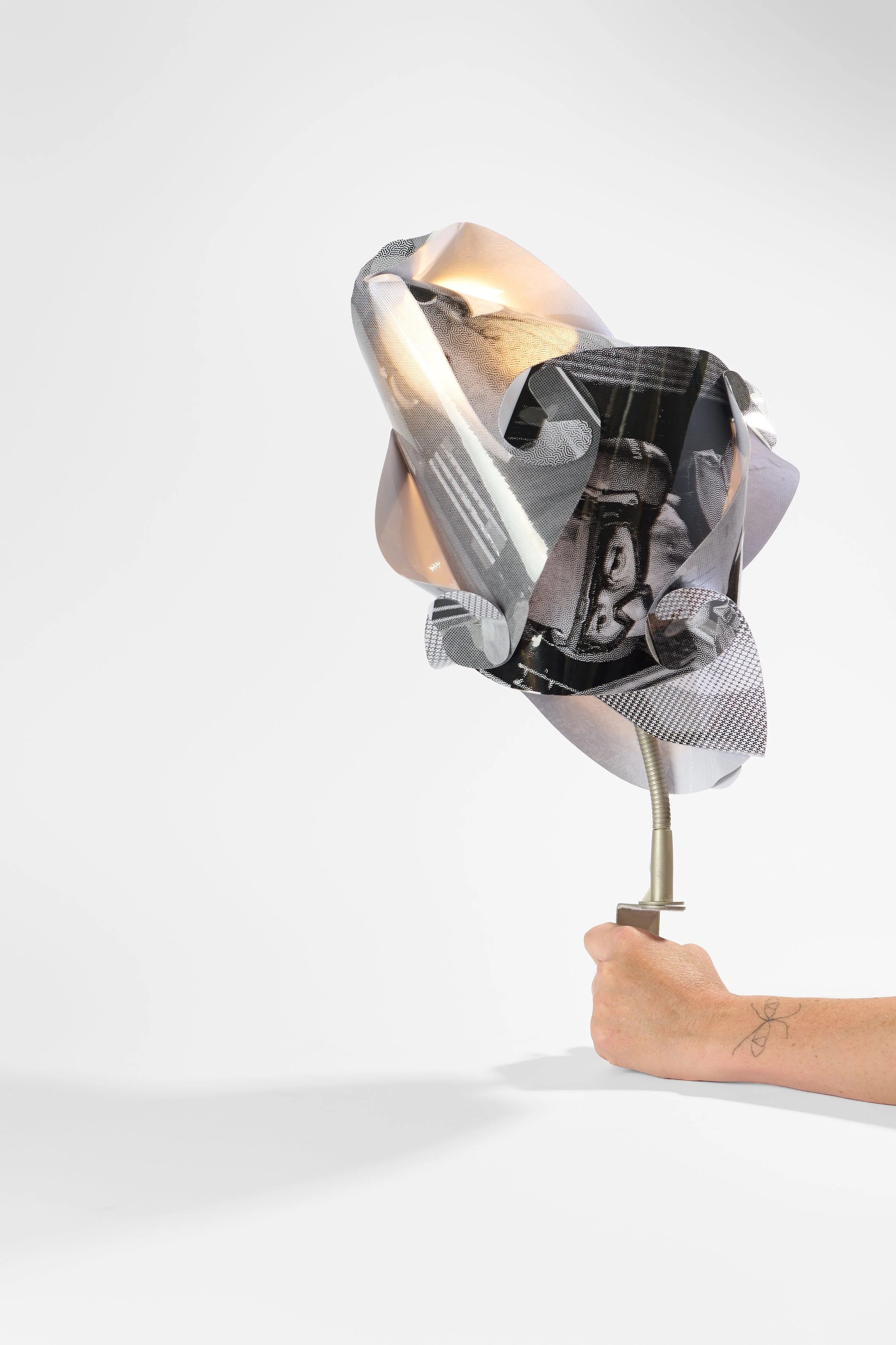 88. Debris Facility Pty Ltd, ‘PlastiCorpus 2.6’, 2024–2026, found Light fixtures, replica ‘IQ lampshades’, processed digital images, laminated printed paper, 55x28x28cm. Price: $700