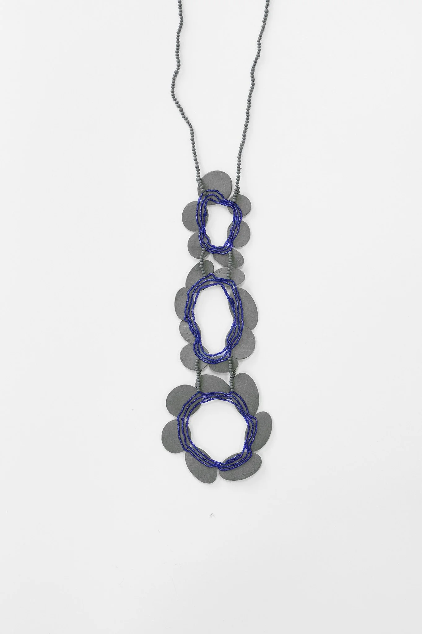 29. Mascha Moje, ‘Untitled’, (3 vertical flowers blue), 2025, porcelain, ceramic flowers, oxidized sterling silver and cobalt glass beads, pendant 23x8cm, necklace 24cm. Price: $2,600 