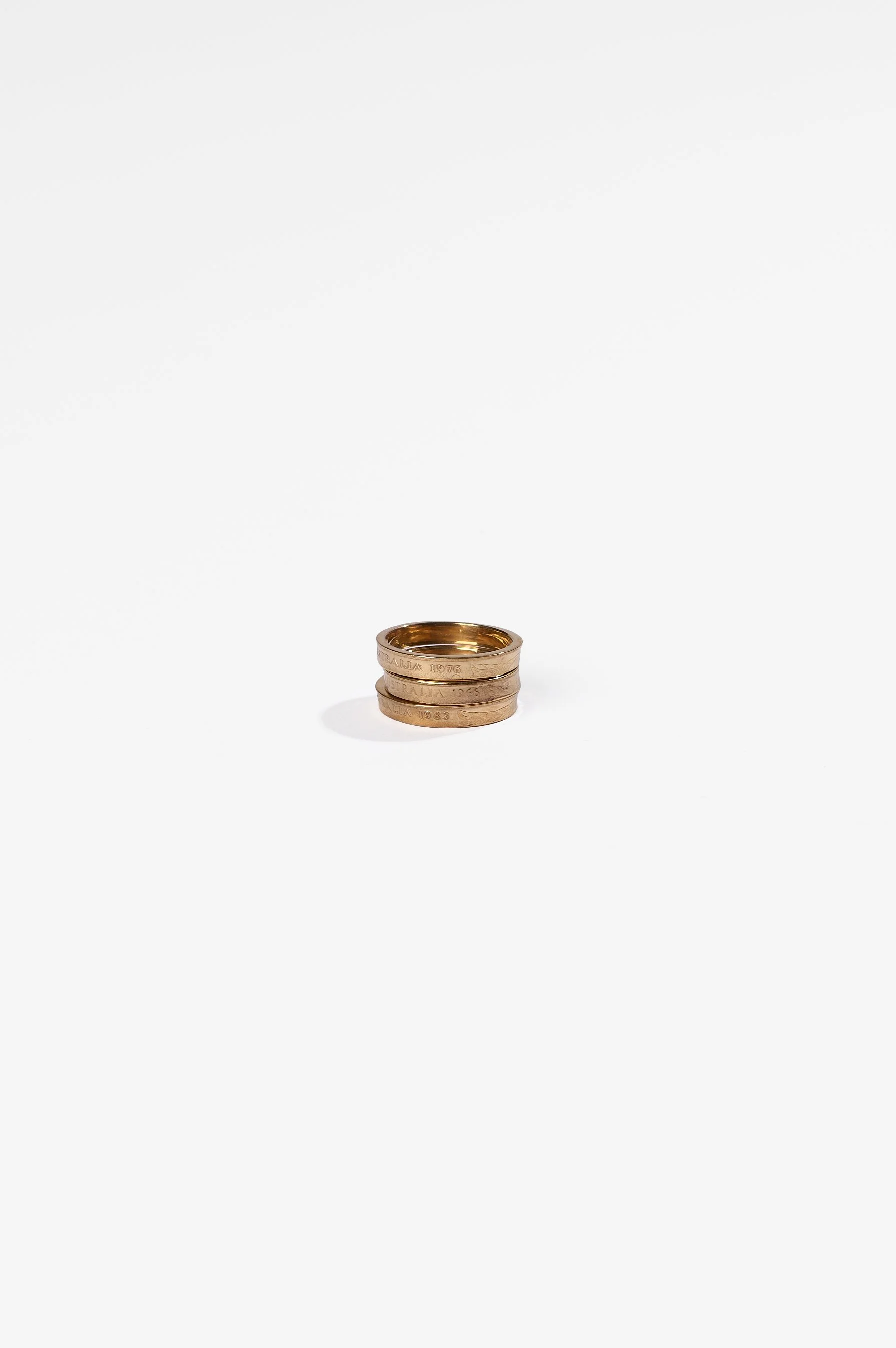 Sarah Ross, Recession rings 2.0, copper 2 cent coin, 24ct gold plate, various dates and sizes available, 2026, $290 each. Photography: Ross Coulter