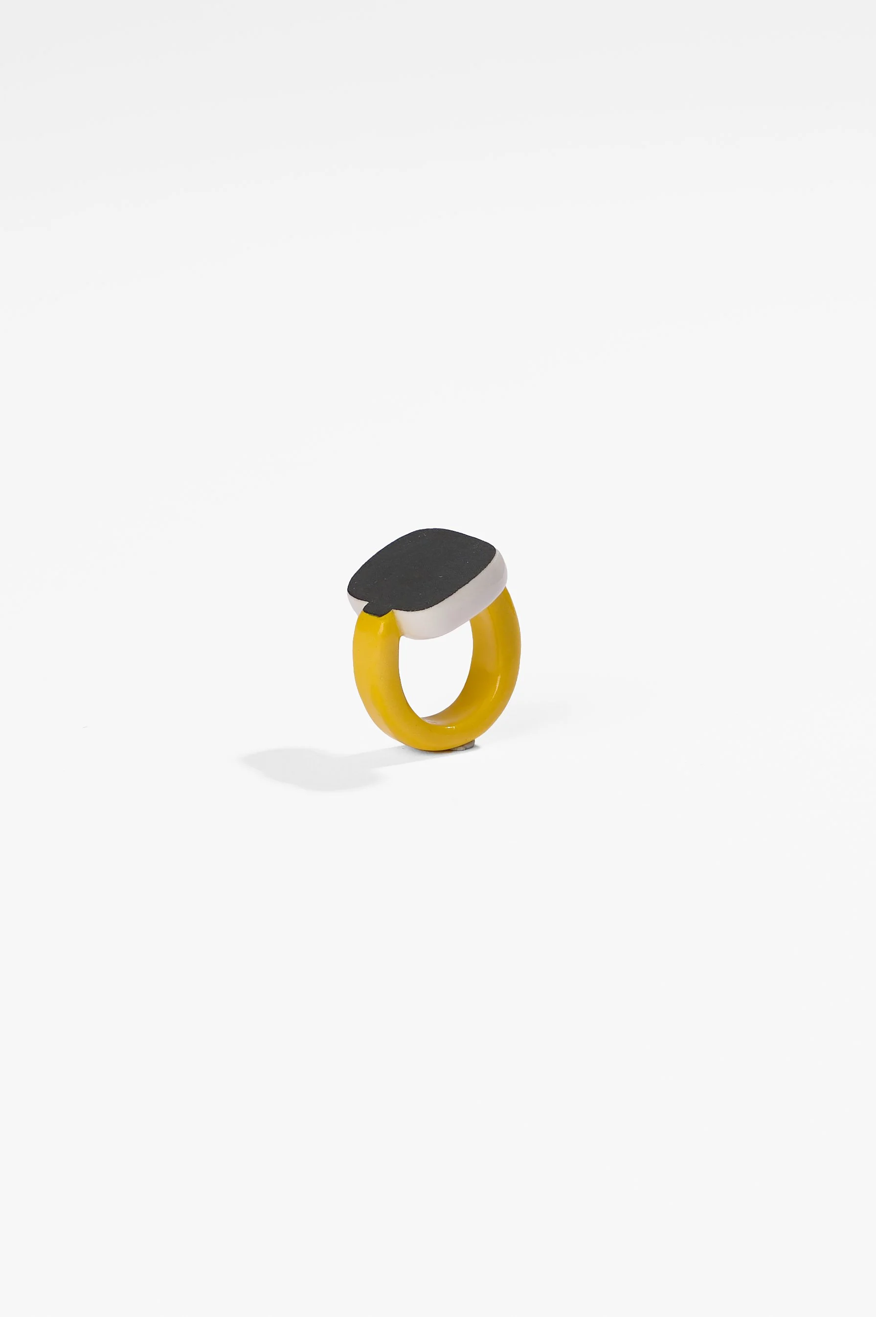Manon van Kouswijk, Rings for Found Hands (yellow, black and white), porcelain, dimensions vary per ring, 2026, $590 each. Photography: Ross Coulter