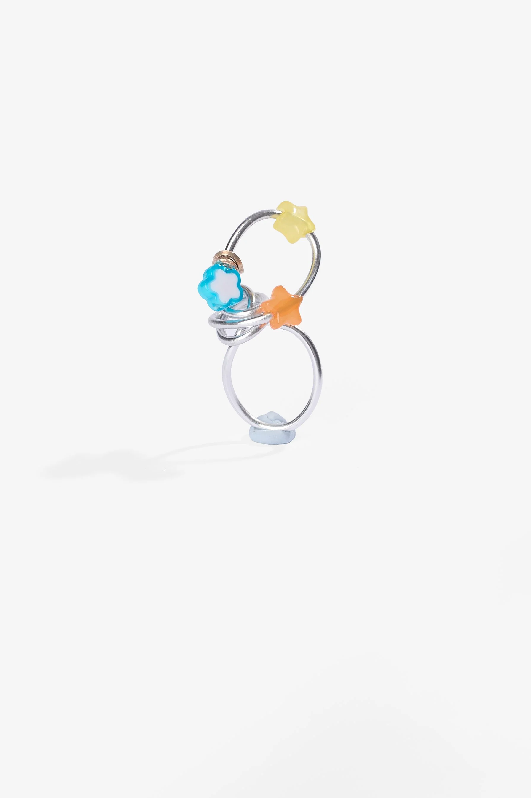 Roma Turnbull-Coulter, Multi-coloured ring, sterling silver, aluminium wire and plastic beads, 2026, $75. Photography: Ross Coulter