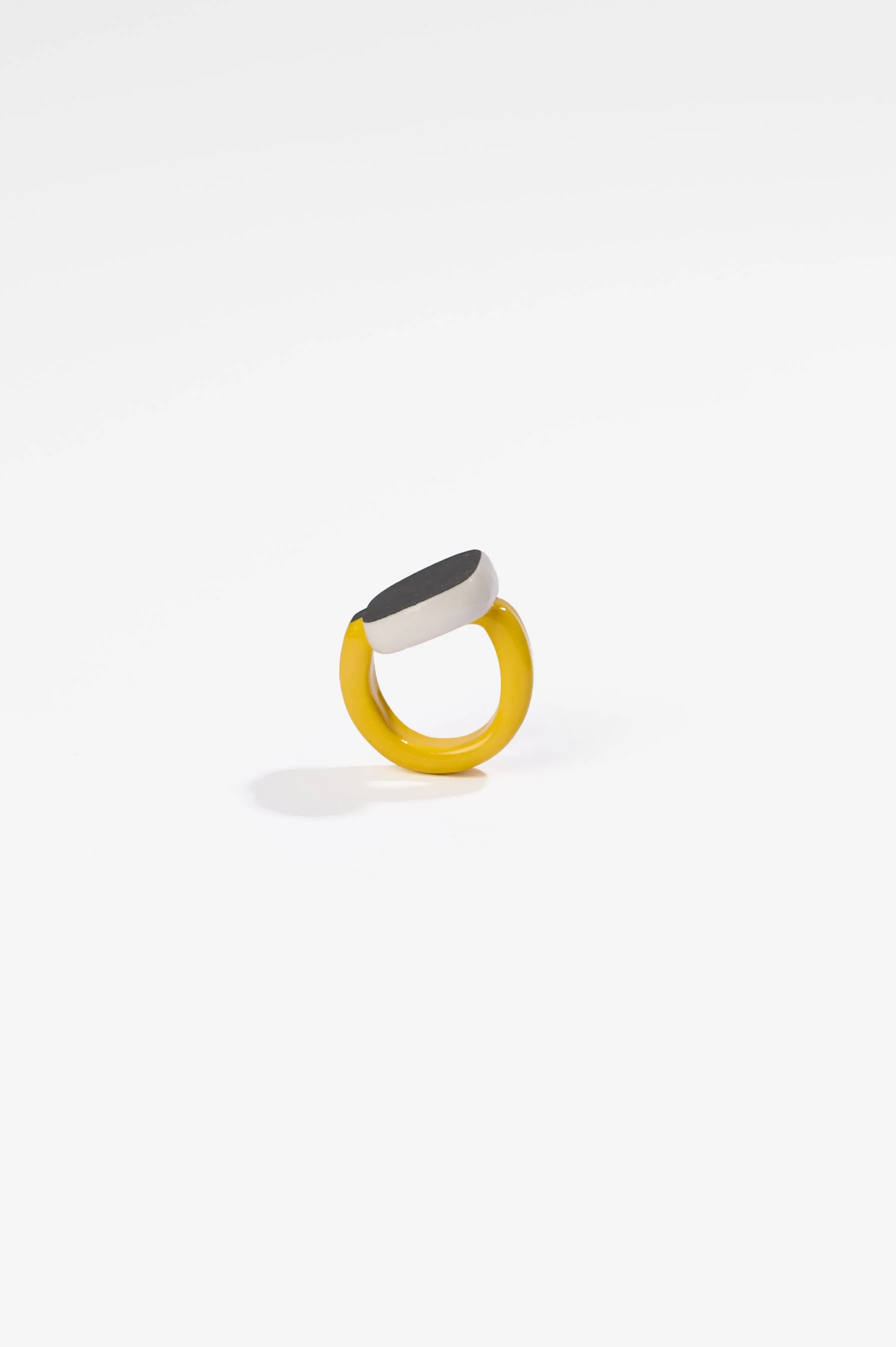 Manon van Kouswijk, Rings for Found Hands (yellow, black and white), porcelain, dimensions vary per ring, 2026, $590 each. Photography: Ross Coulter