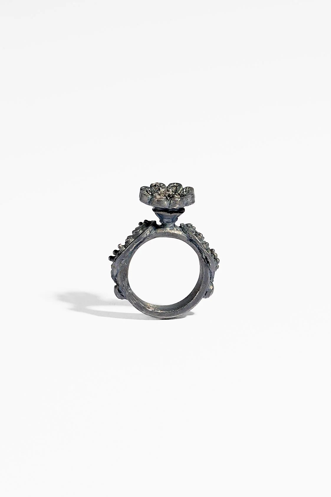 Laila Marie Costa, Untitled 19 (grey ring horizontal flower on top), recycled sterling silver (oxidised) and grey diamond powder, 2.5 x 3.5 x 1.5cm, 11.7gms, $1500. Photography: Ross Coulter
