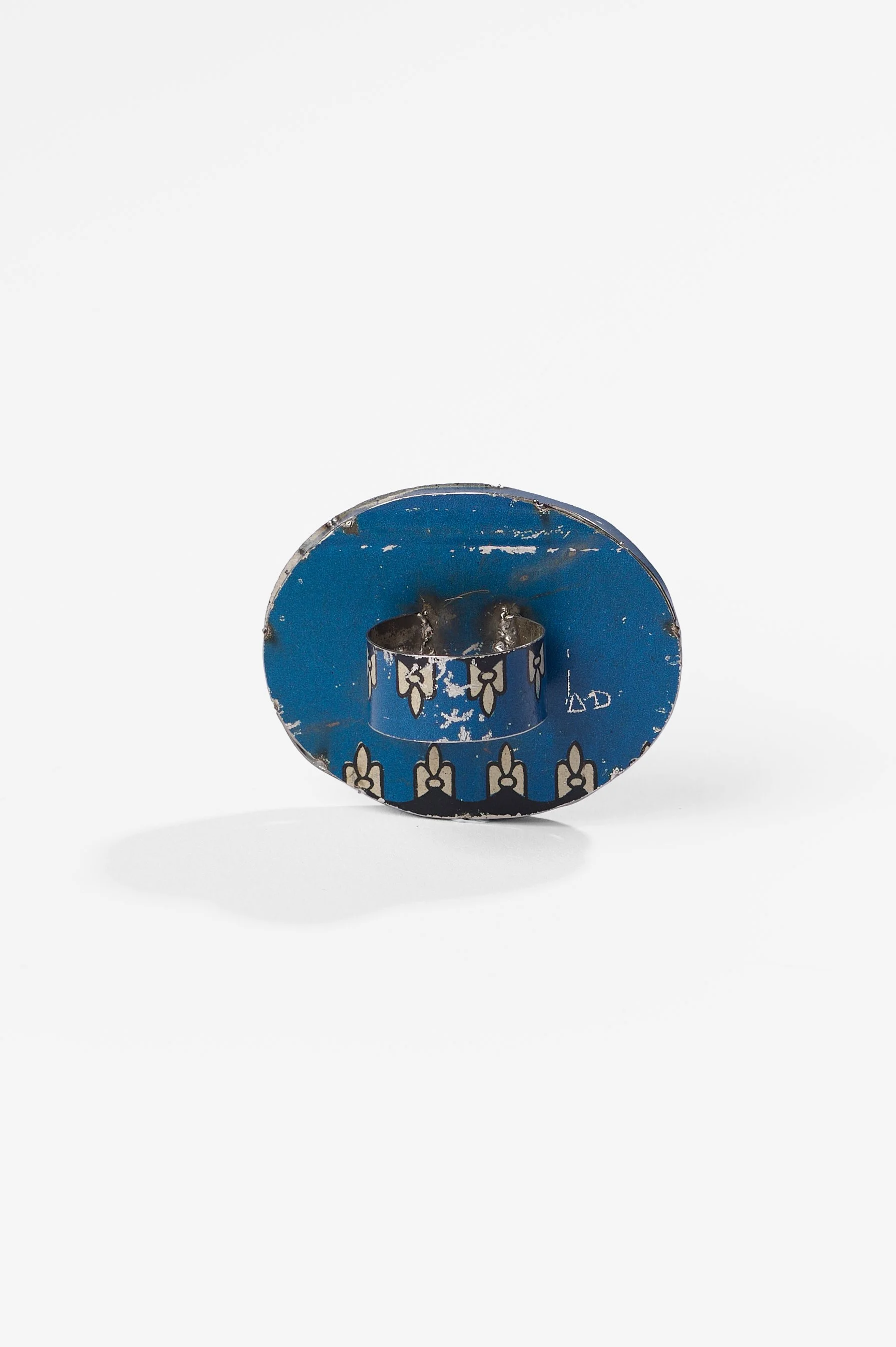 Anna Davern. 'Union Jack ring (blue)' biscuit tin, 50x40x25mm, size , 2026, $380. Photography: Ross Coulter