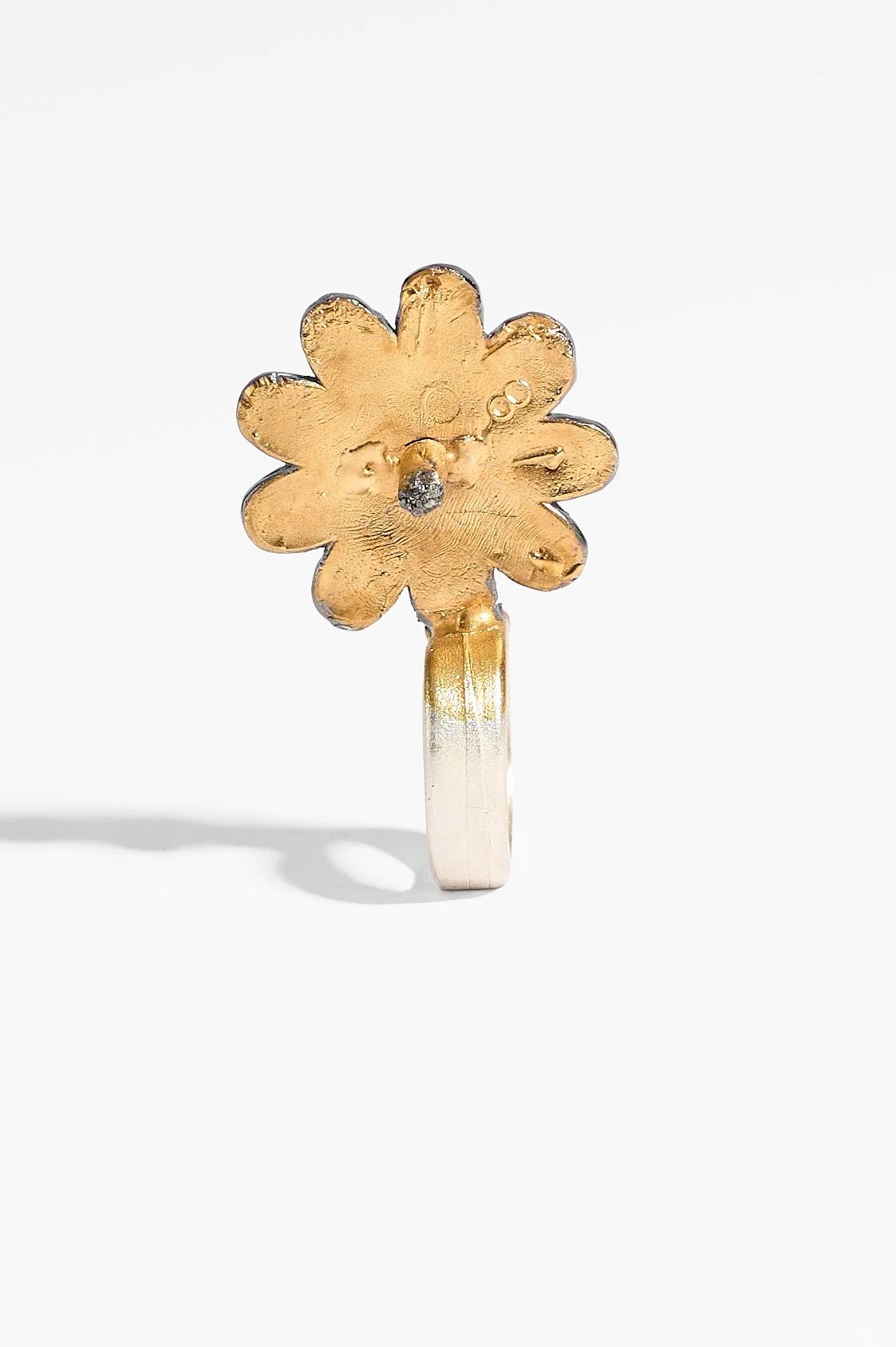 Laila Marie Costa, Untitled 1 (large gold sideways flower with stamen), sterling silver, gold plating, oxidisation, black diamond powder, 3.5 x 5.5 x 2cm, 19.7gms, $1500. Photography: Ross Coulter