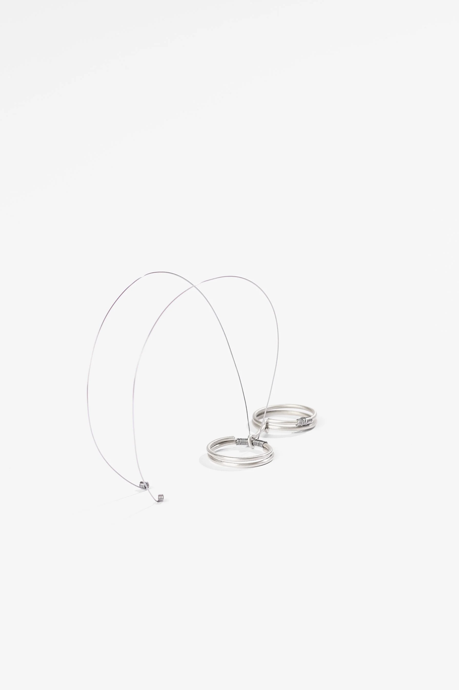 Nadia Cao-Alahananthan, Ơi (Uh-ee) Ring, sterling silver wire, binding wire, 10 x 1.9 x 6cm, 2026, $190 each. Photography: Ross Coulter
