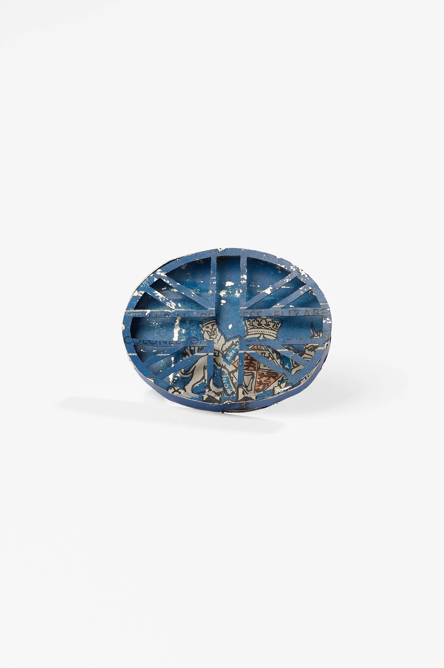 Anna Davern. 'Union Jack ring (blue)' biscuit tin, 50x40x25mm, size , 2026, $380. Photography: Ross Coulter