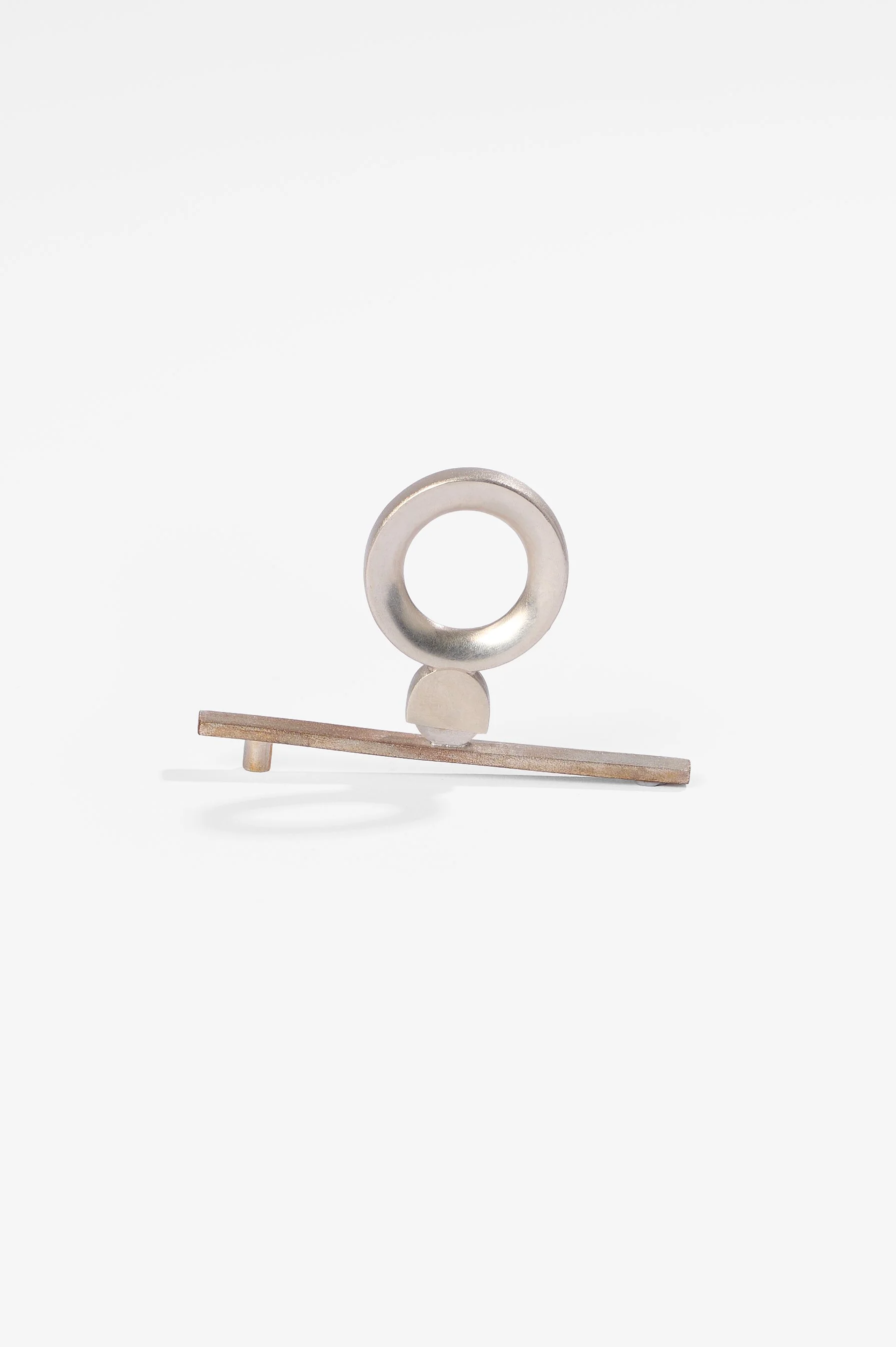 Thao Bui, See saw, sterling silver, shibuichi, 42mm x 69.5mm, 2026, $2,100 Photography: Ross Coulter