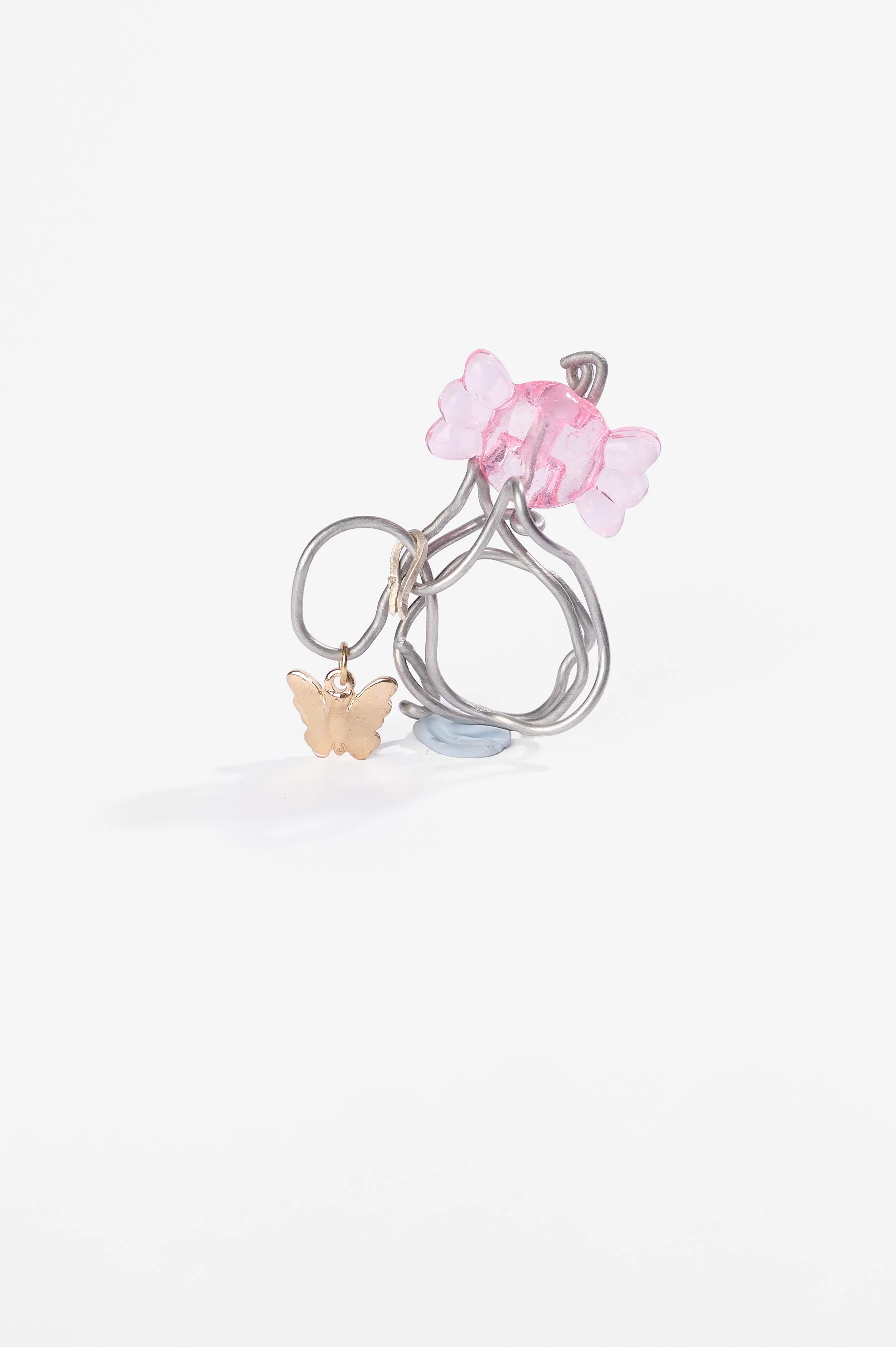 Roma Turnbull-Coulter, Pink ring, aluminium wire, metal trinket, plastic and glass beads, 2026, $75. Photography: Ross Coulter