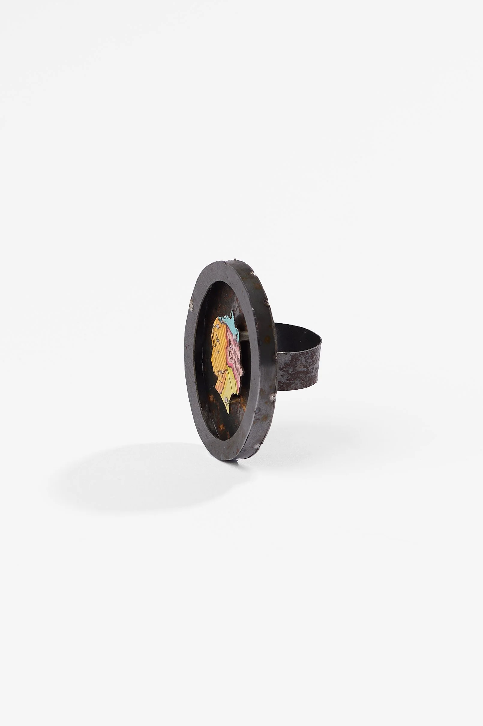 Anna Davern. 'Empire ring (British Guiana)', biscuit tin, tin globe, 40x35x22mm size , 2026, $380. Photography: Ross Coulter