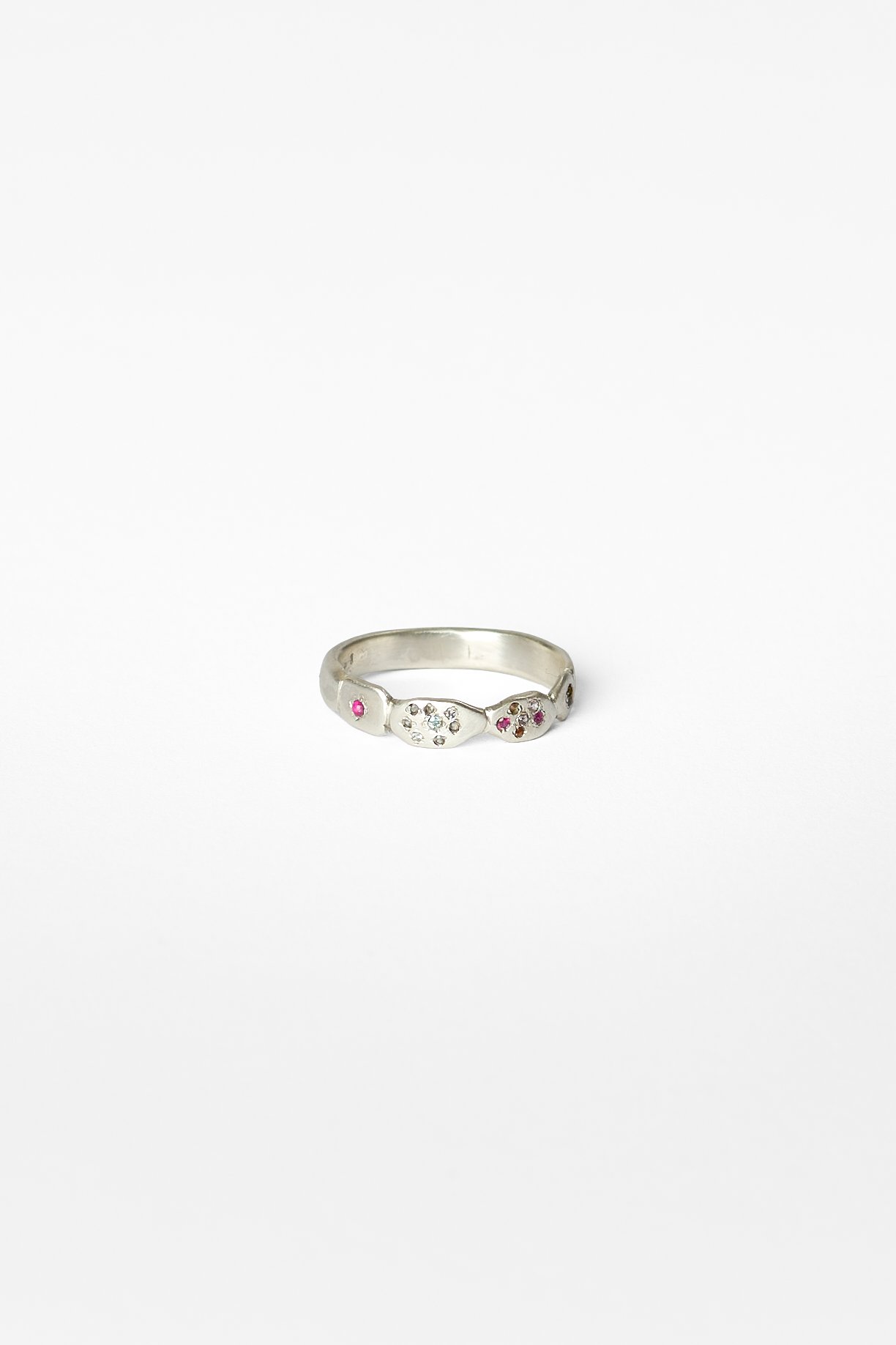 9. Audrey Tan, ‘crumbling footpath ii’, 2026
recycled sterling silver, lab grown gemstones (spinel, ruby, moissanite, corundum), tourmaline, approx. size S1/2. Price: $450