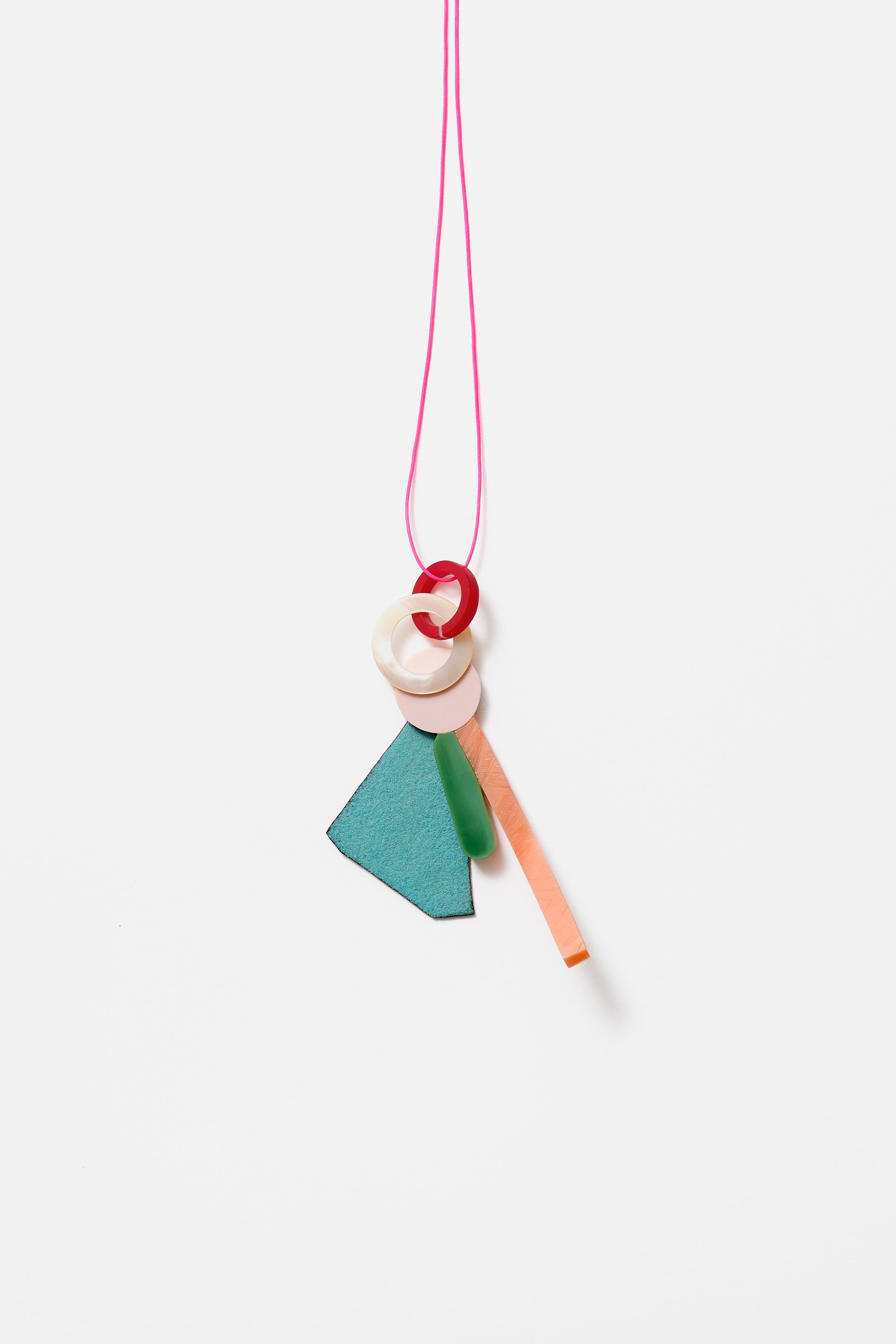 40. Danny Schwaag, ‘solo / – movement 10’, pendant/(wall) object, 2022, galalith, mother of pearl, enamel on copper, silver, 9.5x6x2.5cm. Price: $1,100