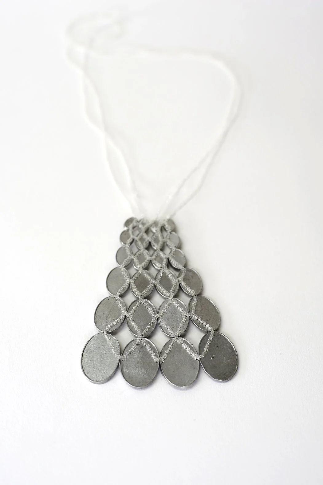 30. Mascha Moje, ‘Untitled’, (trapezoid aluminium pendant), 2024, aluminium, glass beads, pendant 8x11cm, necklace 22.5cm. Price: $1,500
