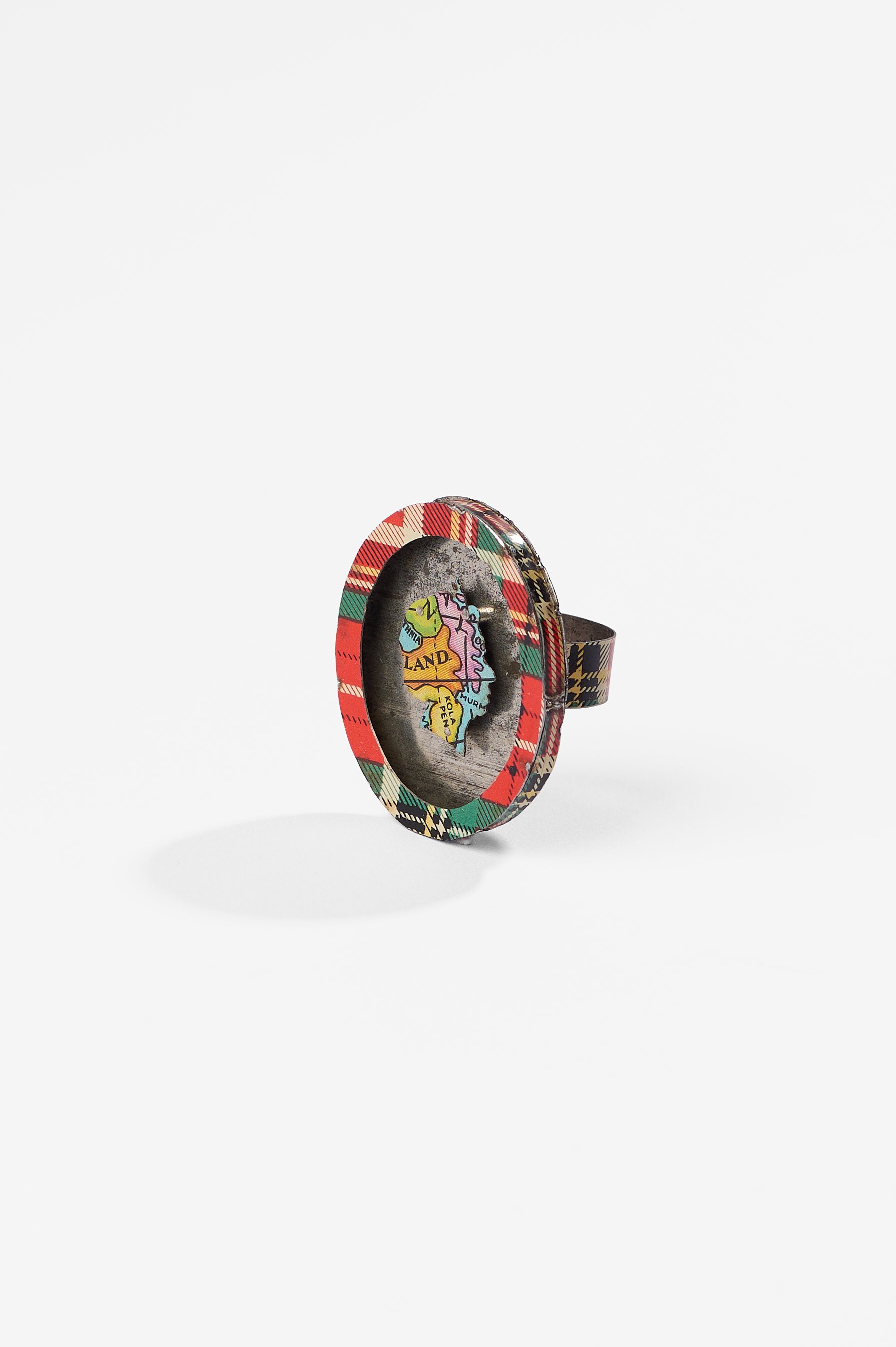 Anna Davern. 'Empire ring (Kola Peninsula)', biscuit tin, tin globe, 40x35x24mm, size 2026. $380. Photography: Ross Coulter