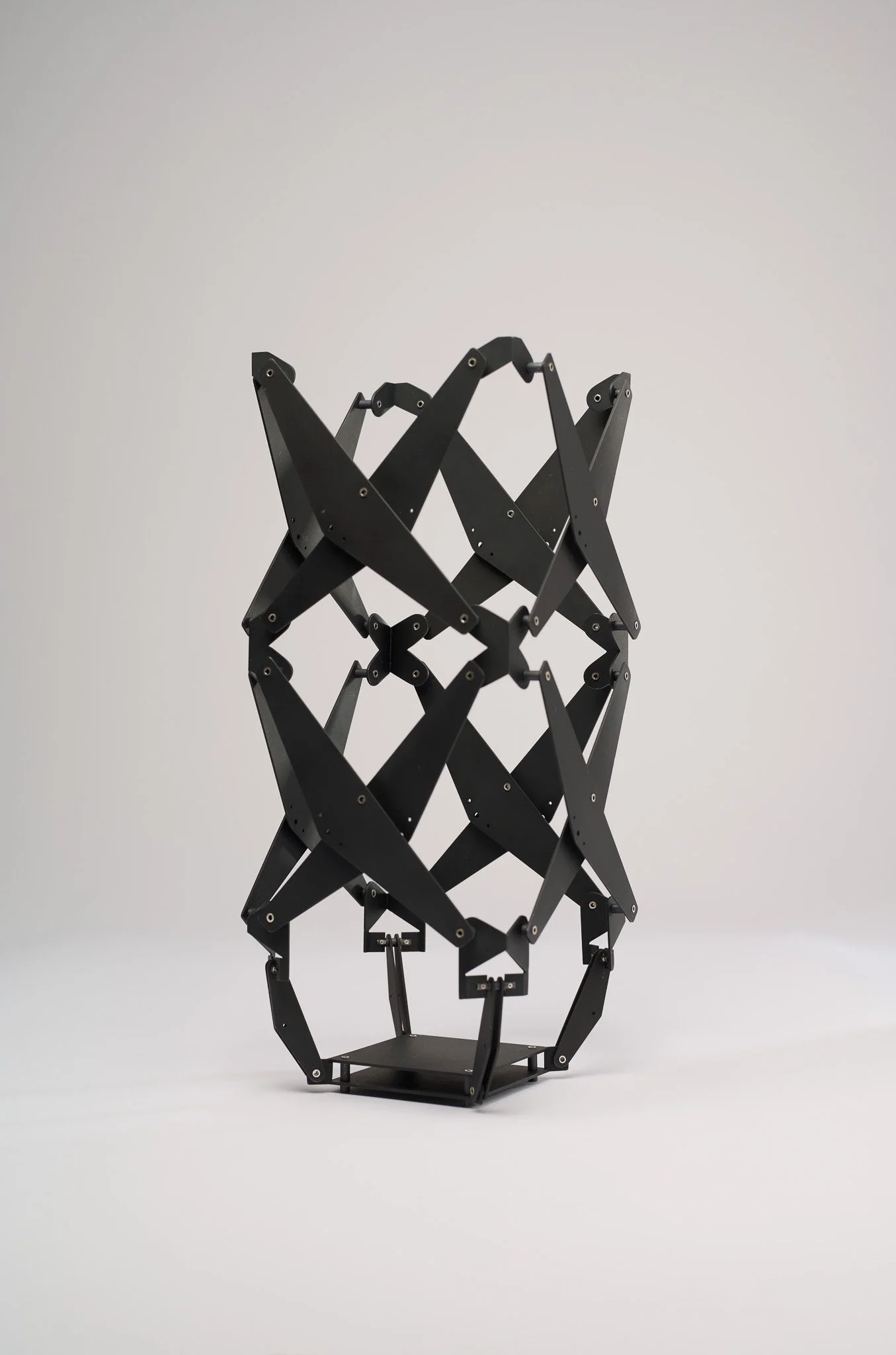 91. Katie Collins, ‘Vessel 3’, 2025
blackened steel, oxidised sterling silver, sterling silver, articulated vessel: 9x9cm wide x 30cm high to 14.5x14.5wide x 13cm high. Price: $3,300